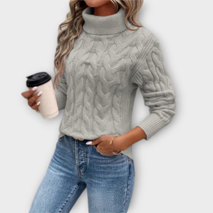 Amelia - Elegante dolcevita rosa con motivo a trecce