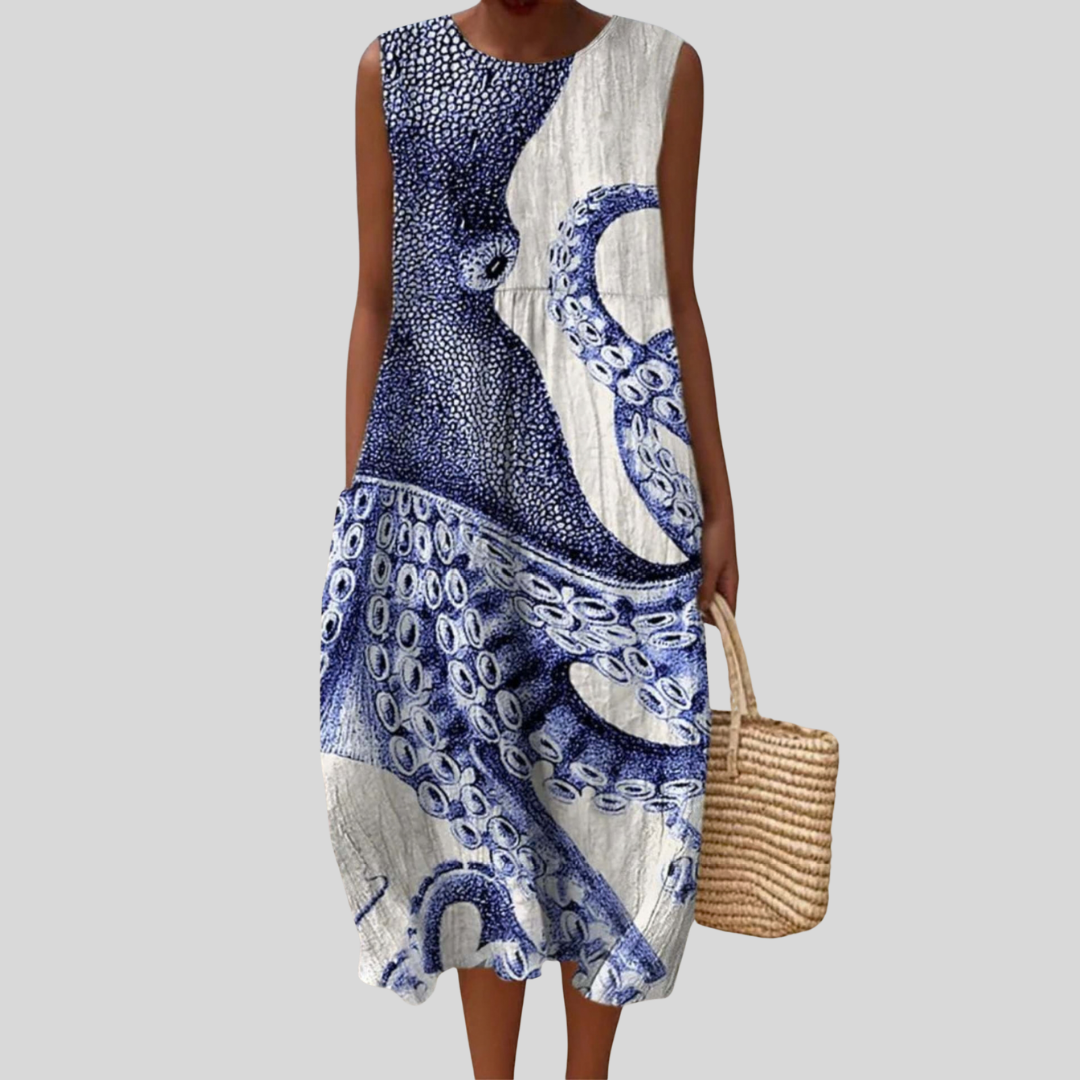 Vestito bianco e blu con motivo a piovre