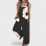 Clémentine - Schwarze Latzhose mit grosser Blüte