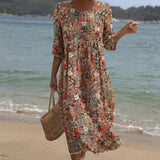 Sara - Cremefarbenes Maxikleid mit Streublumen